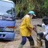 Ian Allen/Photographer
A man gets help  to free himself from mud that blocked section of the guava Ridge to Mavis Bank main road after overnight rains caused landslides in the area.